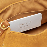BABY POSTINA® MESSENGER BAG IN NUBUCK LEATHER BROWN BRANDY | Zanellato