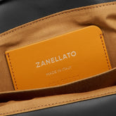 DOTTA® BABY BAG IN SMOOTH BLACK LAVAGNA LEATHER | Zanellato